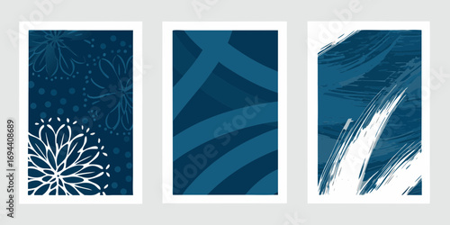 Three abstract vertical panels featuring dark blue and white designs with floral and brushstroke elements
