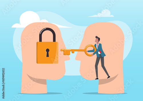 A businessman standing between the two heads, holding a giant key