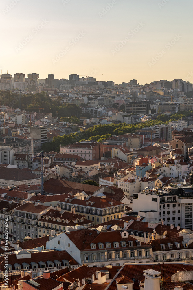 Fototapeta premium Lisbon cityscape with red rooftops and modern skyline 