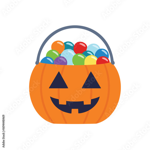 Orange jackolantern bucket filled with colorful candies and treats halloween pumpkin
