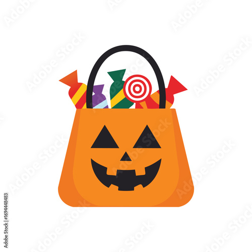 Orange pumpkin bag filled with colorful candies halloween candy