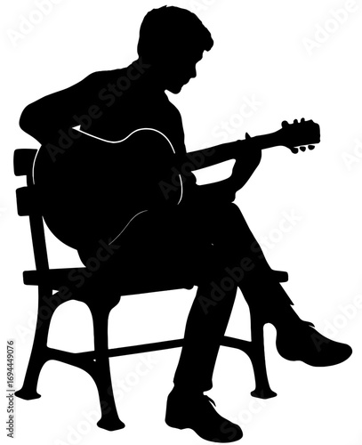 Silhouette of Man Playing Guitar While Sitting on Bench