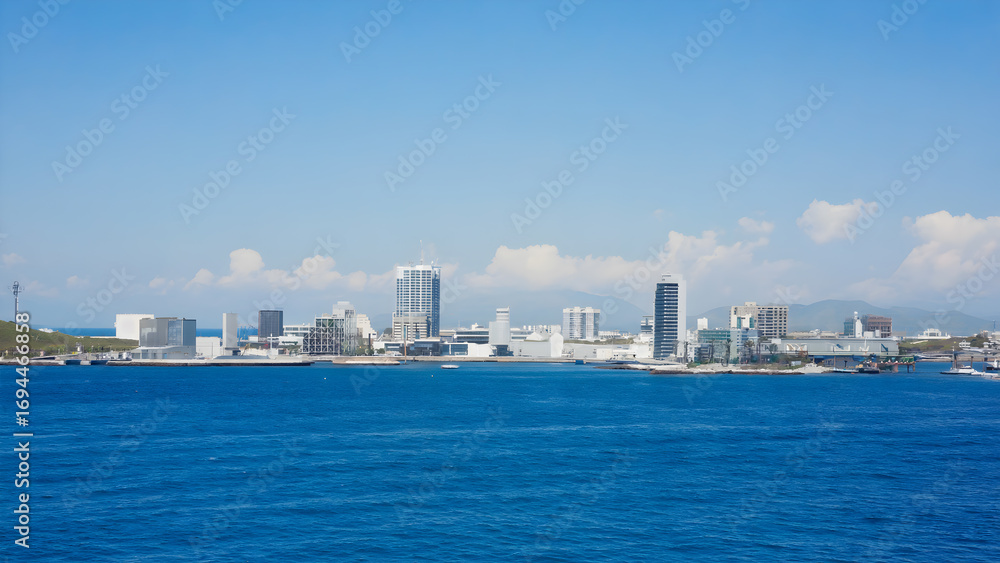 Scenic ocean view of a cityscape with modern buildings under a clear blue sky during daytime Scenic ocean view of a cityscape with modern buildings under a clear blue sky during daytime