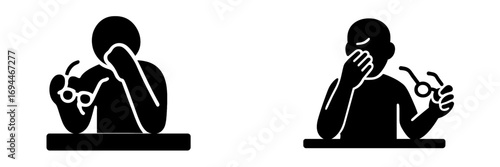 Black glyph icon of a tired person with eye strain taking off glasses and rubbing eyes from overwork or fatigue