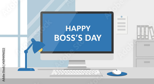 A modern office desk setup with a computer monitor displaying a "Happy Boss's Day" greeting.