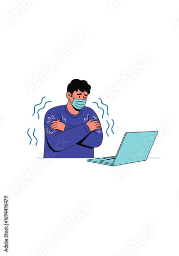 Person wearing mask feeling cold shivers while working on a laptop at home