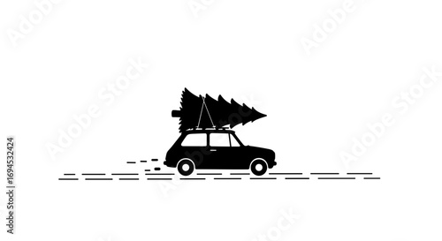 Car transporting Christmas tree while driving on snowy road  