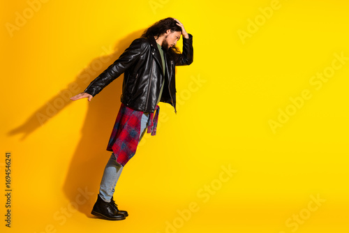 Canvastavla Attractive stylish man with long dark hair poses confidently in a leather jacket