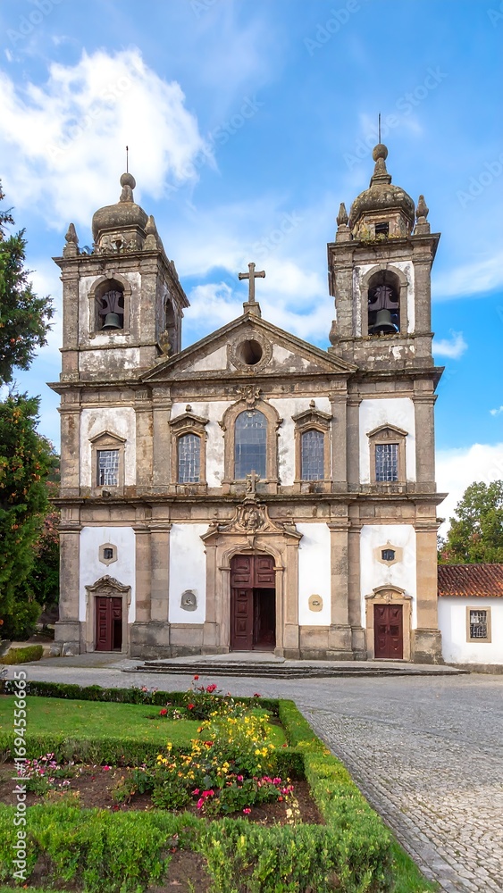 Fototapeta premium Historic church facade, gardens