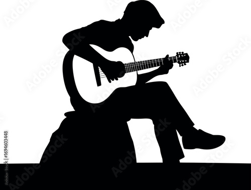 Silhouette of a musician playing guitar