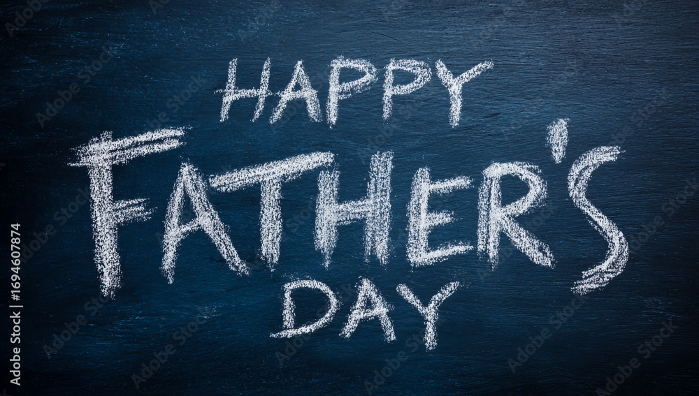 Fototapeta premium Happy fathers day chalk message written on a textured dark blue background