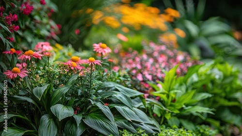 A vibrant garden scene with a variety of colorful flowers and green foliage.