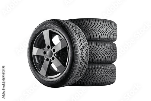 Car tires with a great profile in the car repair shop. Set of summer or winter tyres in front of white fond. On transparent PNG background.