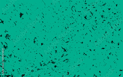 Green grunge background with black scratches and distressed texture, perfect for posters, flyers, and creative design projects.