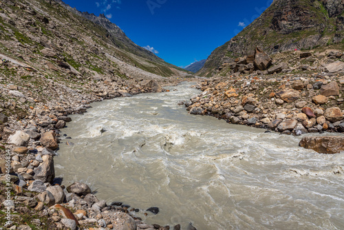 The balance between sediment in transport and deposits on river bed is given by Exner equation, depends on the upwards velocity on the particle ie drag and lift forces, settling velocity of particle.