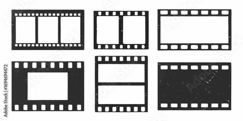 Collection of six vintage film strips with blank frames and perforations on white background