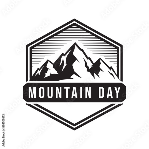 Mountain day emblem with stylized peaks and banner