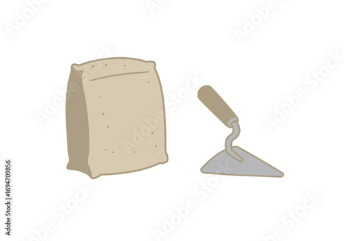 A bag of cement and a trowel are displayed