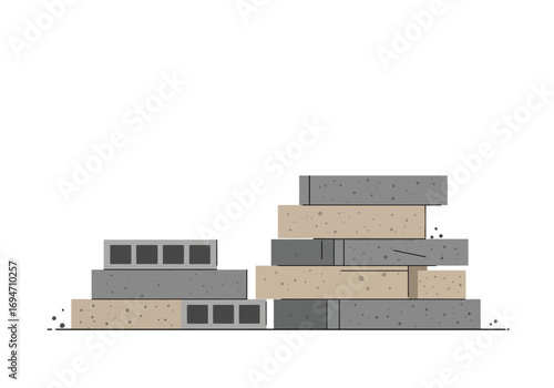 A pile of gray and tan bricks or cinder blocks stacked haphazardly on a white background with some loose debris around the base