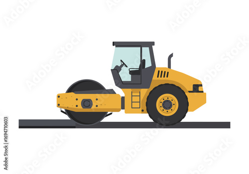 A yellow road roller sits on a gray road