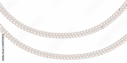 Two elegant strands of light gray pearls draped gracefully against a clean white background
