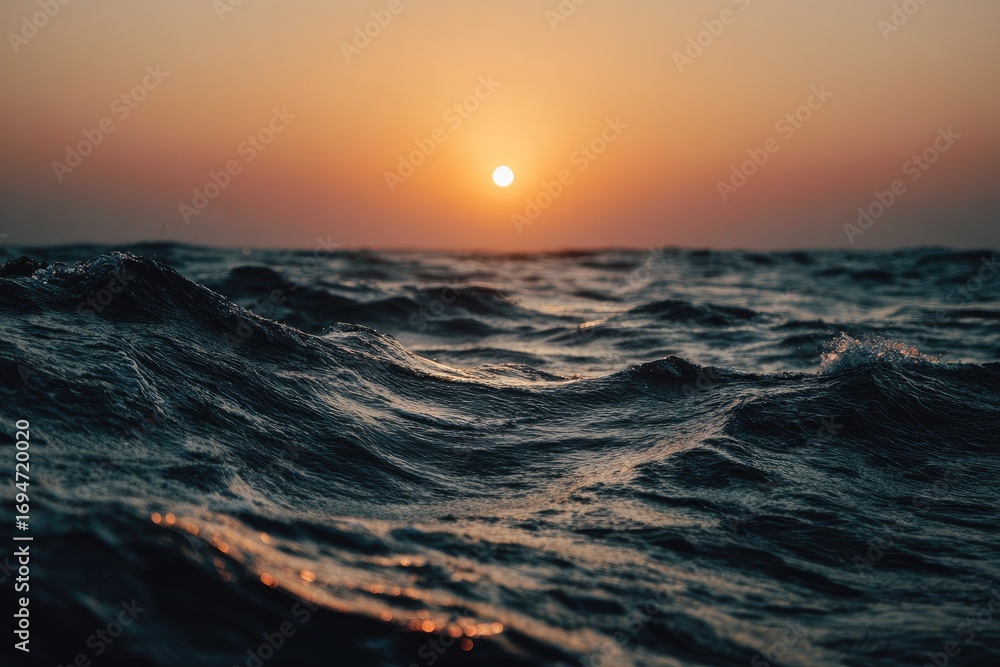 Obraz premium Sunset over a restless sea