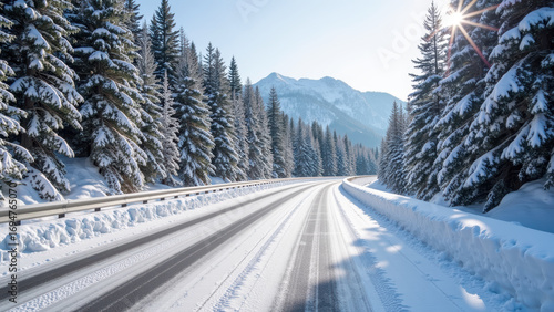 Serene winter landscape featuring snow covered road winding through tall evergreen trees. sunlight glimmers off snow, creating peaceful atmosphere