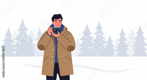 Man taking photos with camera in wintery forest landscape  