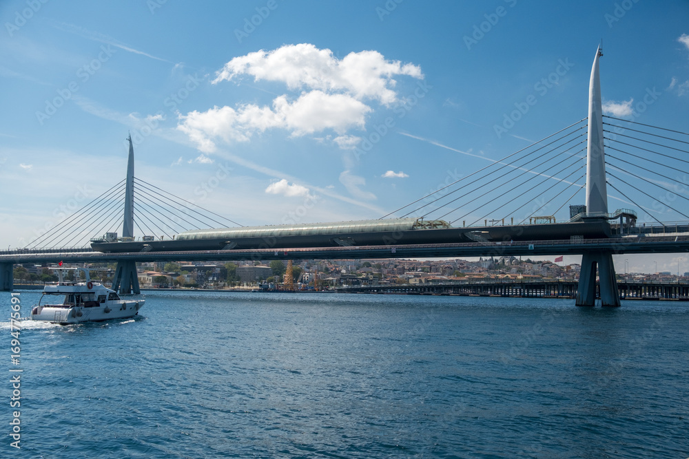 Naklejka premium The various architectural views and perspectives of the Golden Horn Metro Bridge, located in the touristy Eminönü Golden Horn district of Istanbul, its cable-supported design and engineering structure