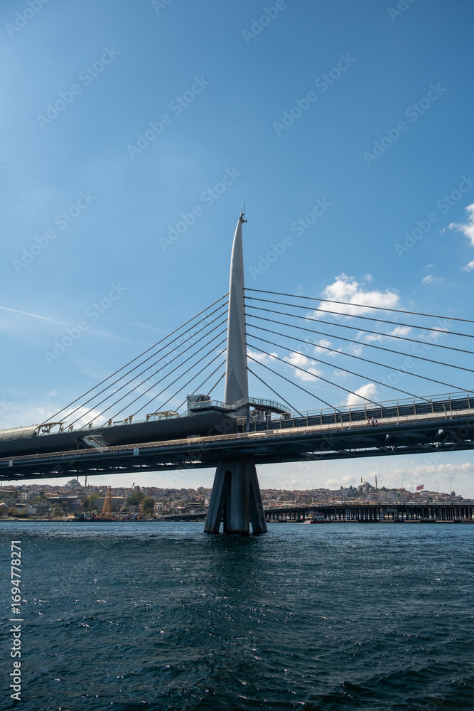 Obraz premium The various architectural views and perspectives of the Golden Horn Metro Bridge, located in the touristy Eminönü Golden Horn district of Istanbul, its cable-supported design and engineering structure