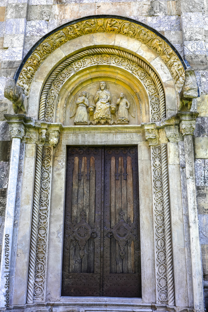 Fototapeta premium Visoki Decani Serbian orthodox monastery church door and tympanum, Kosovo