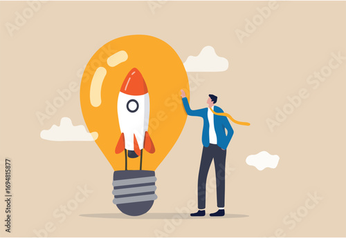 Entrepreneurship, setting up new business, motivation to create new business idea and make it success concept, businessman start up company owner standing with innovative rocket inside lightbulb idea.