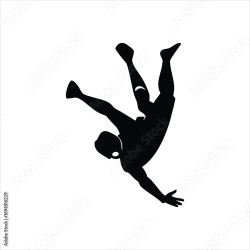 Silhouette of a person falling or jumping with arms outstretched