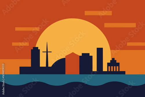 Modern city skyline silhouette at sunset with warm orange sky and blue water