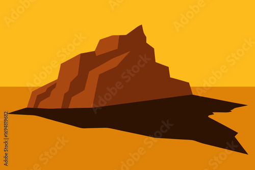 Abstract geometric rock formation casting a long shadow against a warm orange sky