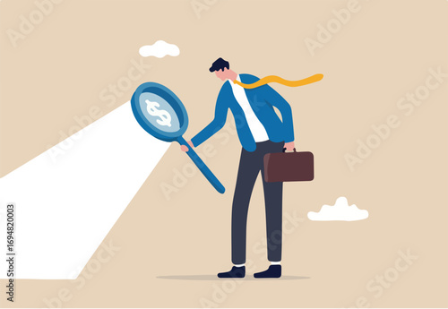 Searching for investment opportunity, stock market research or hidden cost and expense concept, businessman looking through magnifying glass to see dollar money sign search for money. 