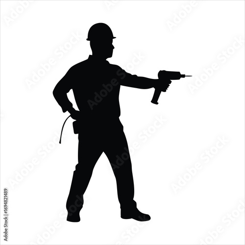 Silhouette of a construction worker holding a drill