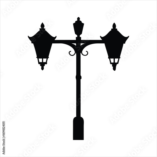 Classic black silhouette of a double lamp post on white background