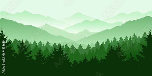 Serene green mountain range with layers of pine trees and misty peaks