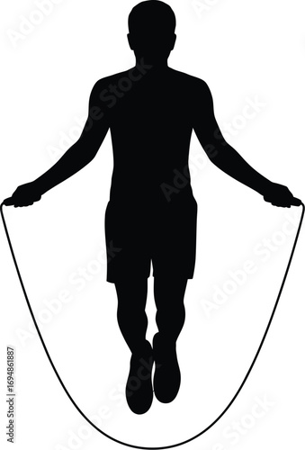 Silhouetted person jumping rope exercise