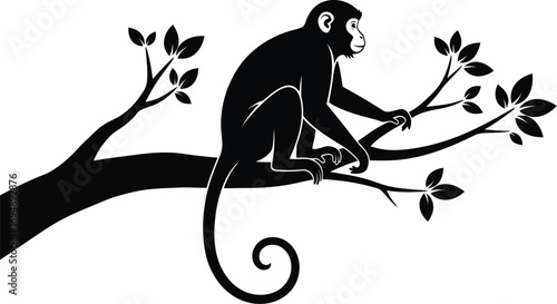 Silhouette of a monkey perched on a tree branch, with leafy foliage.