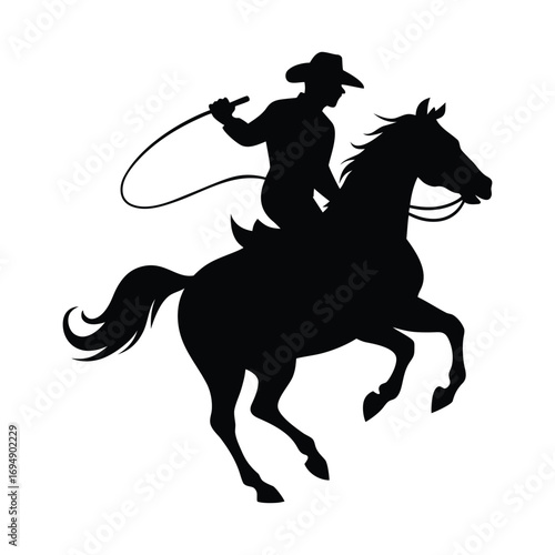 Silhouette of a cowboy on a galloping horse swinging a lasso embodying the spirit of the wild west adventure and rodeo