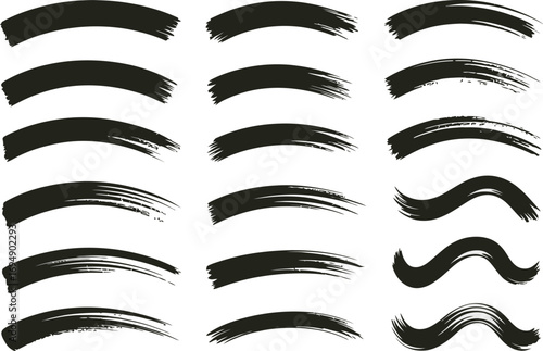 Collection of expressive black brush strokes on a white background, suggesting artistic creation and dynamic movement.