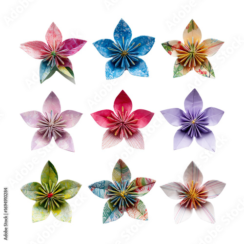 Vibrant assorted origami blossoms artfully arranged top down view