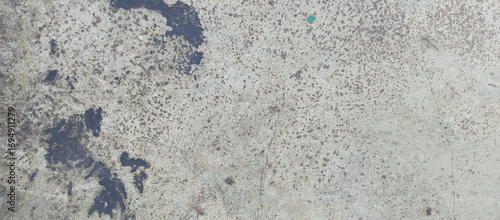 Industrial Grunge Concrete Floor with Splatter Stains