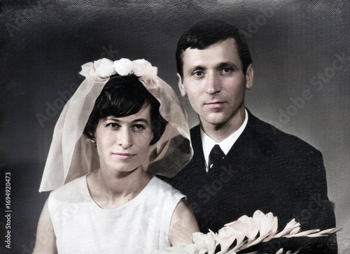 Vintage portrait of young man and woman on their wedding day. Retro photo 1970.