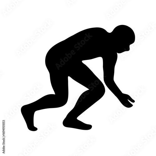 Silhouette of a person in a crouching position about to start running