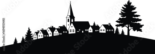 Silhouette of a peaceful village on a hill, church steeple, countryside homes, pine trees, scenic rural landscape at sunset
