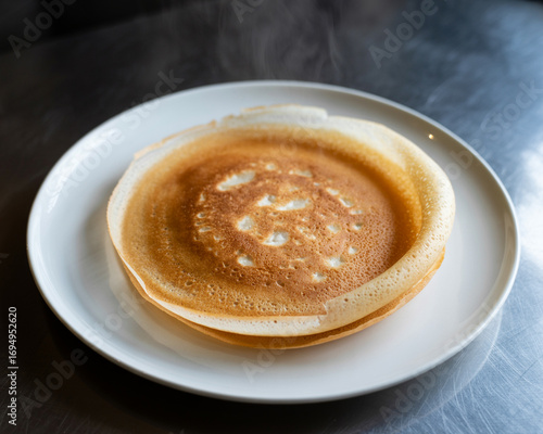 Steaming Appam on a White Plate Keywords: appam, indian food, breakfast, kerala food, south