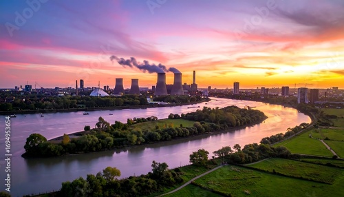 Fototapeta Naklejka Na Ścianę i Meble -  Panoramic sunset over a river and city with power plant